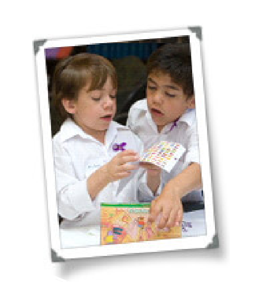 Nicholas and Diangelo two boys in white shirts playing and solving puzzles